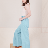 Side view of Bell Bottoms in Baby Blue and vintage off-white Tank Top worn by Hana