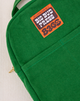 Mini Backpack in Forest Green close up with brown and orange Big Bud Press label
