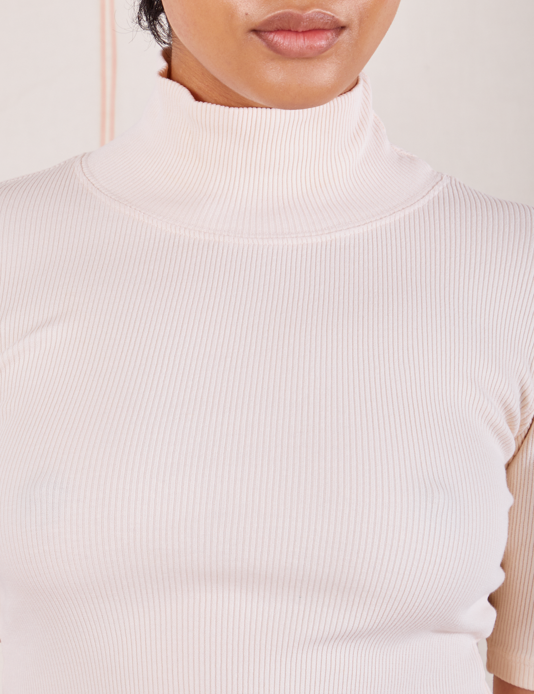 Front close up of 1/2 Sleeve Essential Turtleneck in Vintage Off White on Mika