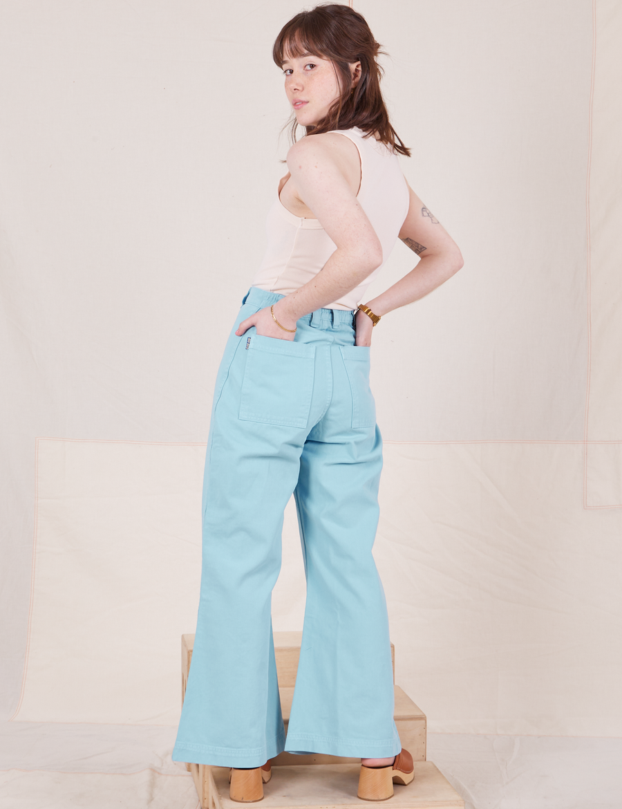 Back view of Bell Bottoms in Baby Blue and vintage off-white Tank Top worn by Hana