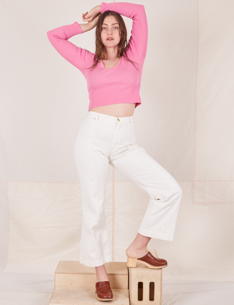 Allison is wearing XXS  Long Sleeve V-Neck Tee in Bubblegum paired with vintage off-white Western Pants