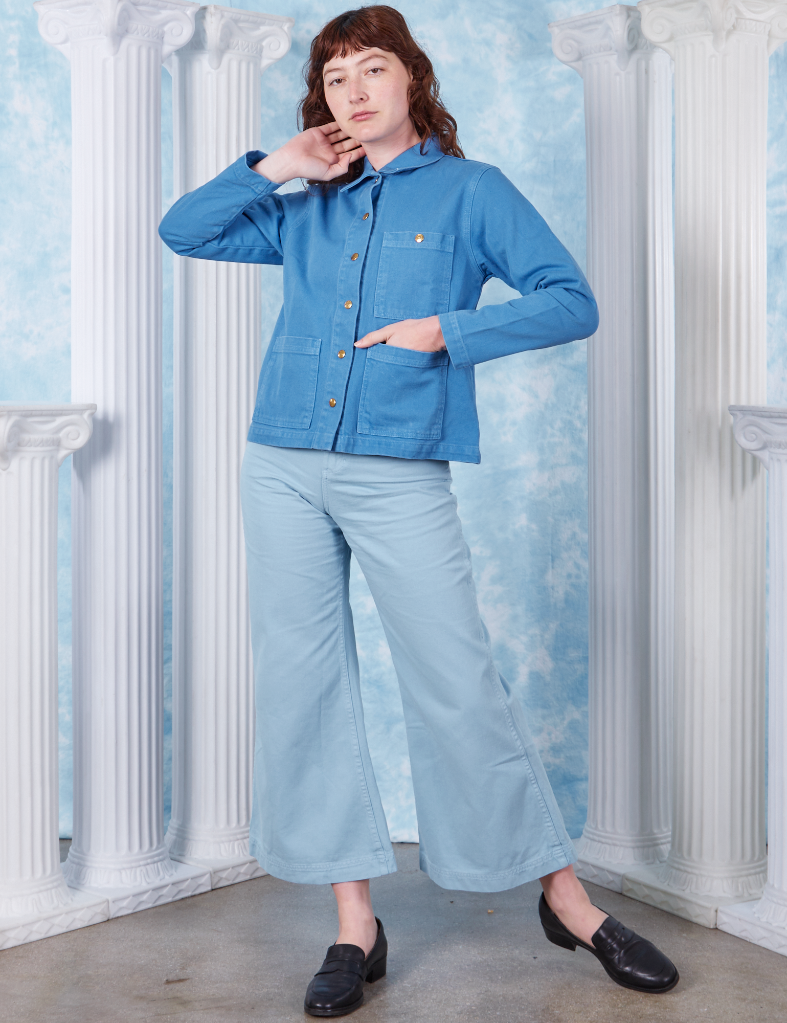 Neoclassical Work Jacket in Blue Venus buttoned up on Alex wearing baby blue Bell Bottoms