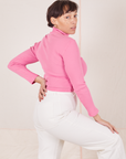 Angled back view of Essential Turtleneck in Bubblegum Pink worn by Tiara