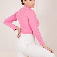 Angled back view of Essential Turtleneck in Bubblegum Pink worn by Tiara
