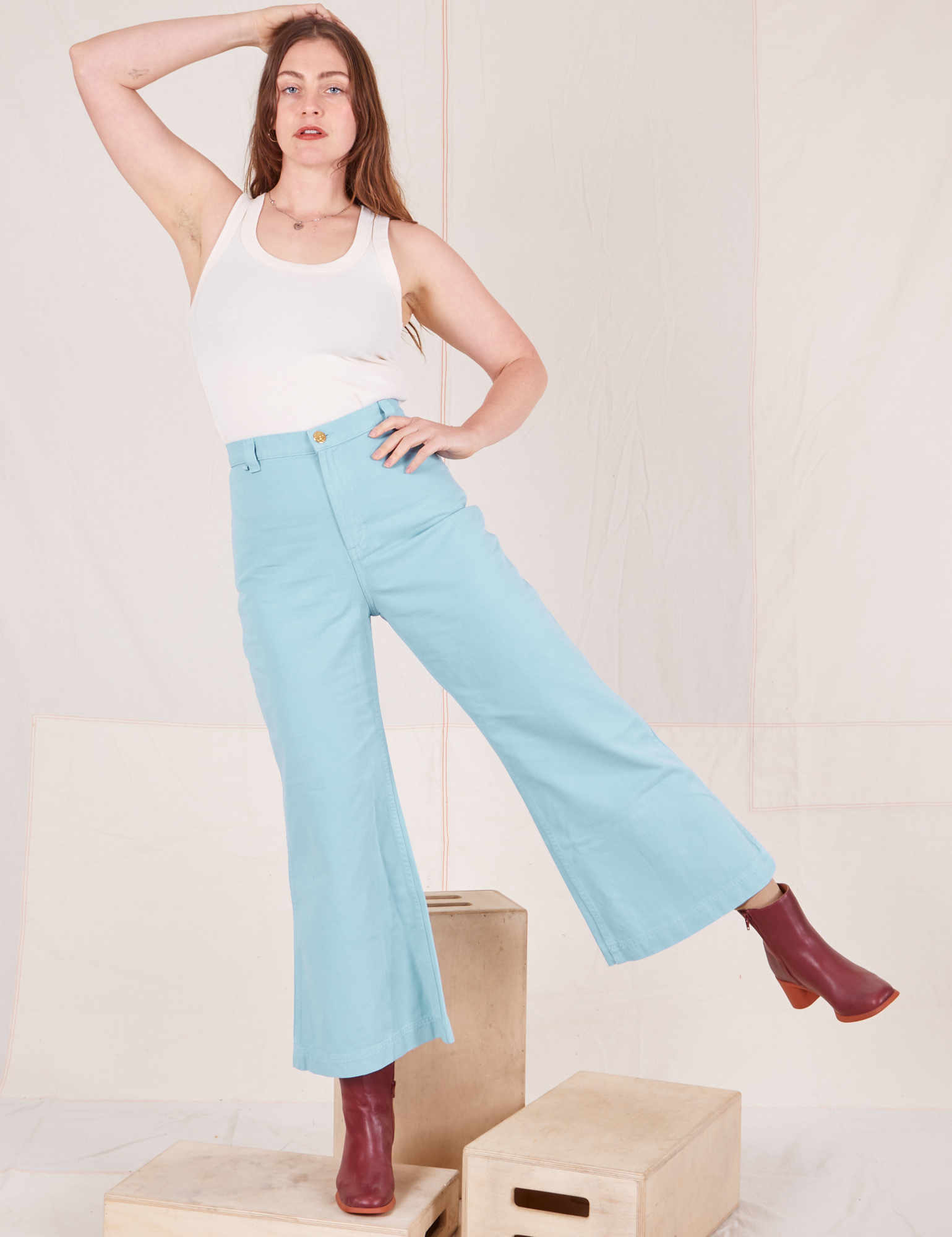 Allison is 5&#39;10&quot; and wearing XS Bell Bottoms in Baby Blue paired with vintage off-white Tank Top