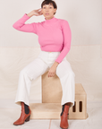 Tiara is wearing Essential Turtleneck in Bubblegum Pink and vintage off-white Western Pants