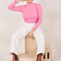 Tiara is wearing Essential Turtleneck in Bubblegum Pink and vintage off-white Western Pants