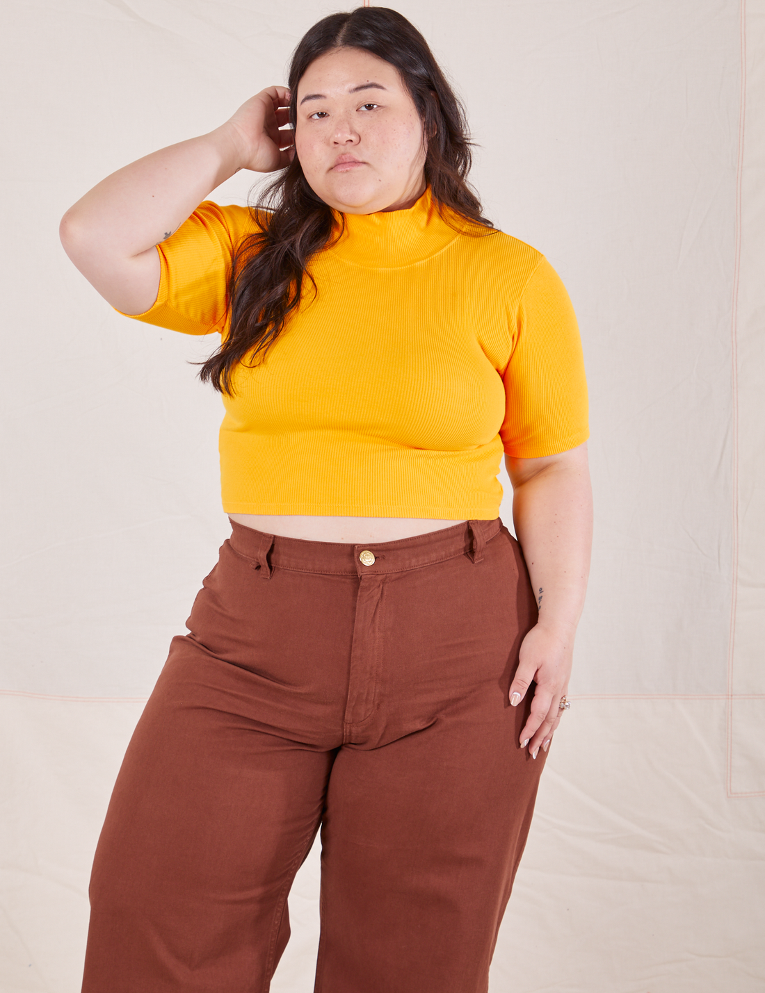 1/2 Sleeve Essential Turtleneck in Sunshine Yellow on Ashley wearing fudgesicle brown Bell Bottoms