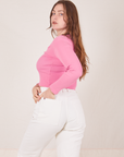 Angled back view of Long Sleeve V-Neck Tee in Bubblegum Pink worn by Allison