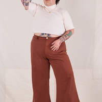 Sam is wearing size XL 1/2 Sleeve Essential Turtleneck in Vintage Off White paired with fudgesicle brown Bell Bottoms