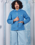 Neoclassical Work Jacket in Blue Venus buttoned up on Jesse wearing baby blue Bell Bottoms