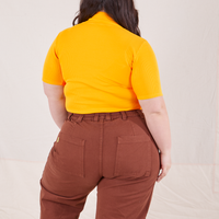 1/2 Sleeve Essential Turtleneck in Sunshine Yellow back view on Ashley wearing fudgesicle brown Bell Bottoms