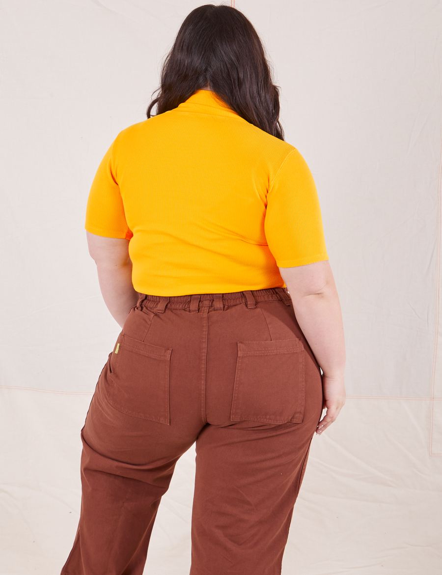 1/2 Sleeve Essential Turtleneck in Sunshine Yellow back view on Ashley wearing fudgesicle brown Bell Bottoms