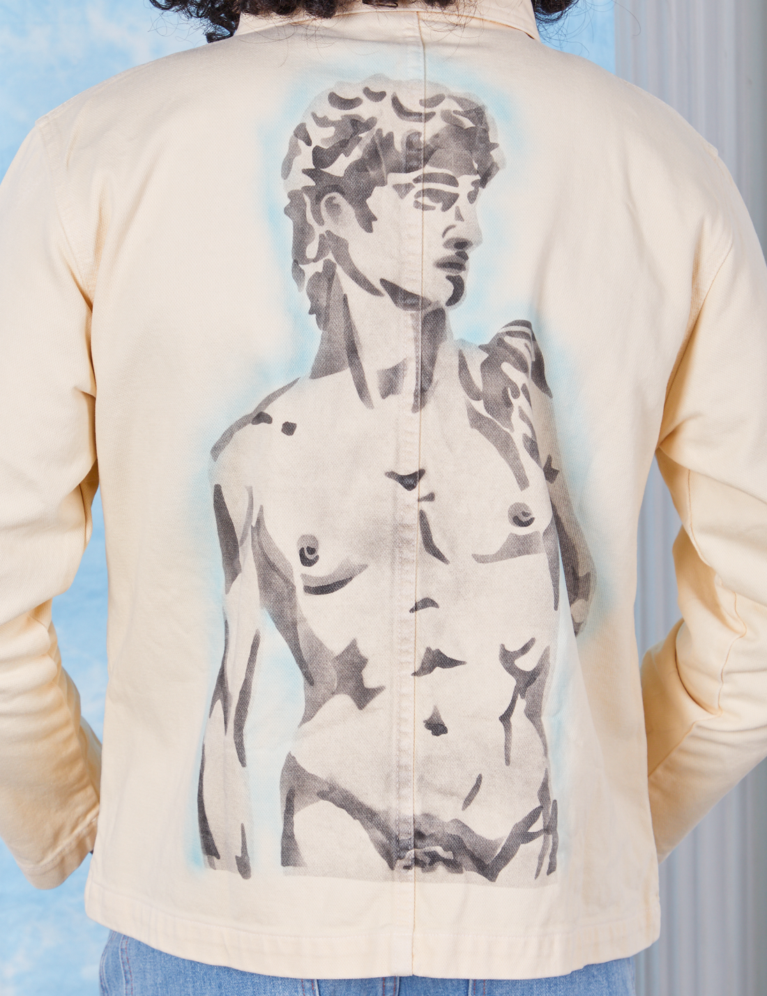 Vintage off-white Neoclassical Work Jacket featuring airbrushed Statue of David worn by Jesse
