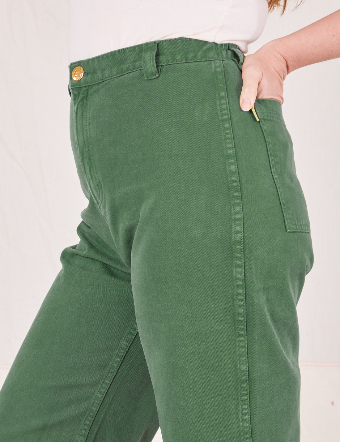 Side view close up of Bell Bottoms in Dark Emerald Green worn by Allison