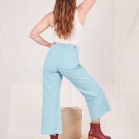 Back view of Bell Bottoms in Baby Blue and vintage off-white Tank Top worn by Allison
