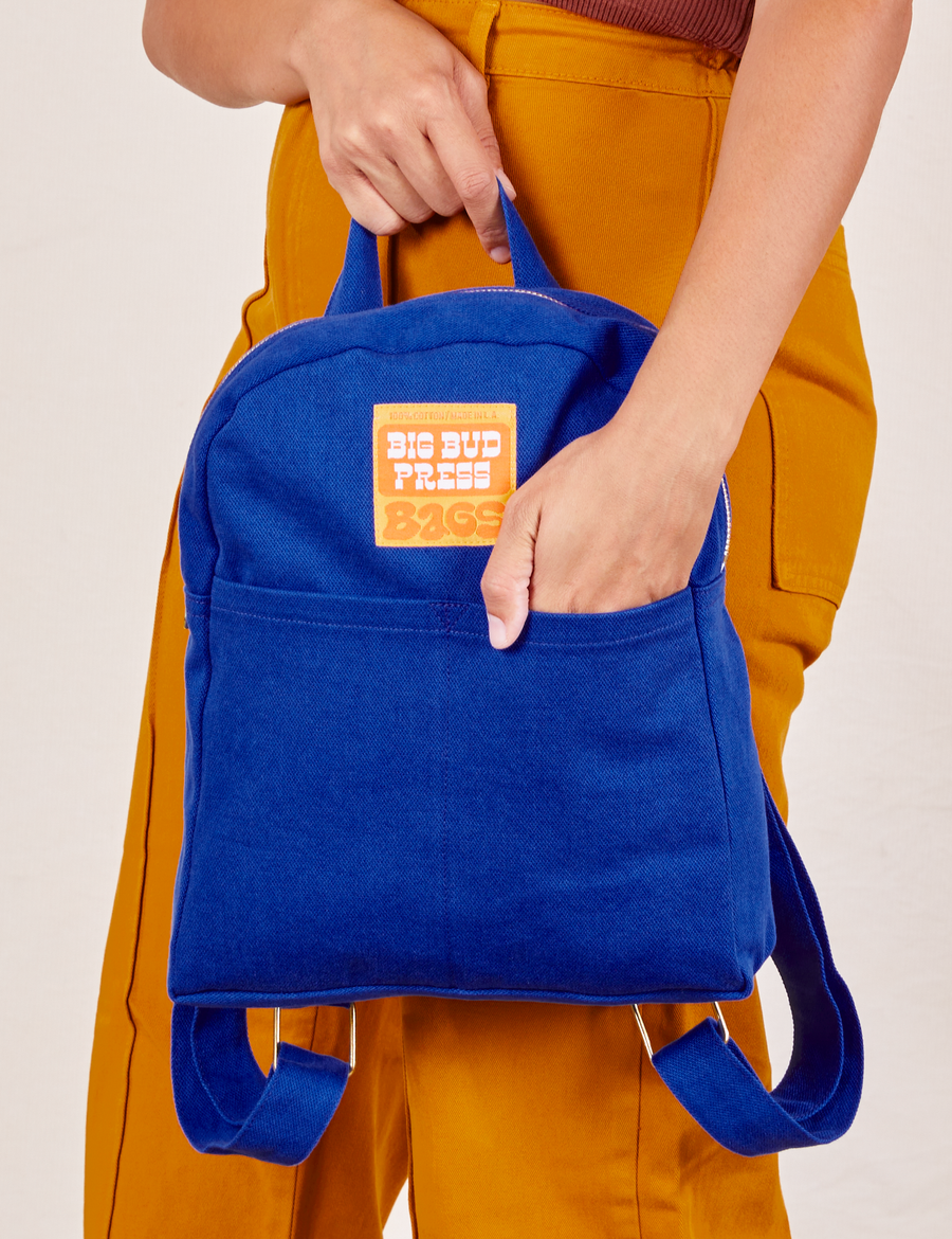 Mini Backpack in Royal Blue held by Tiara
