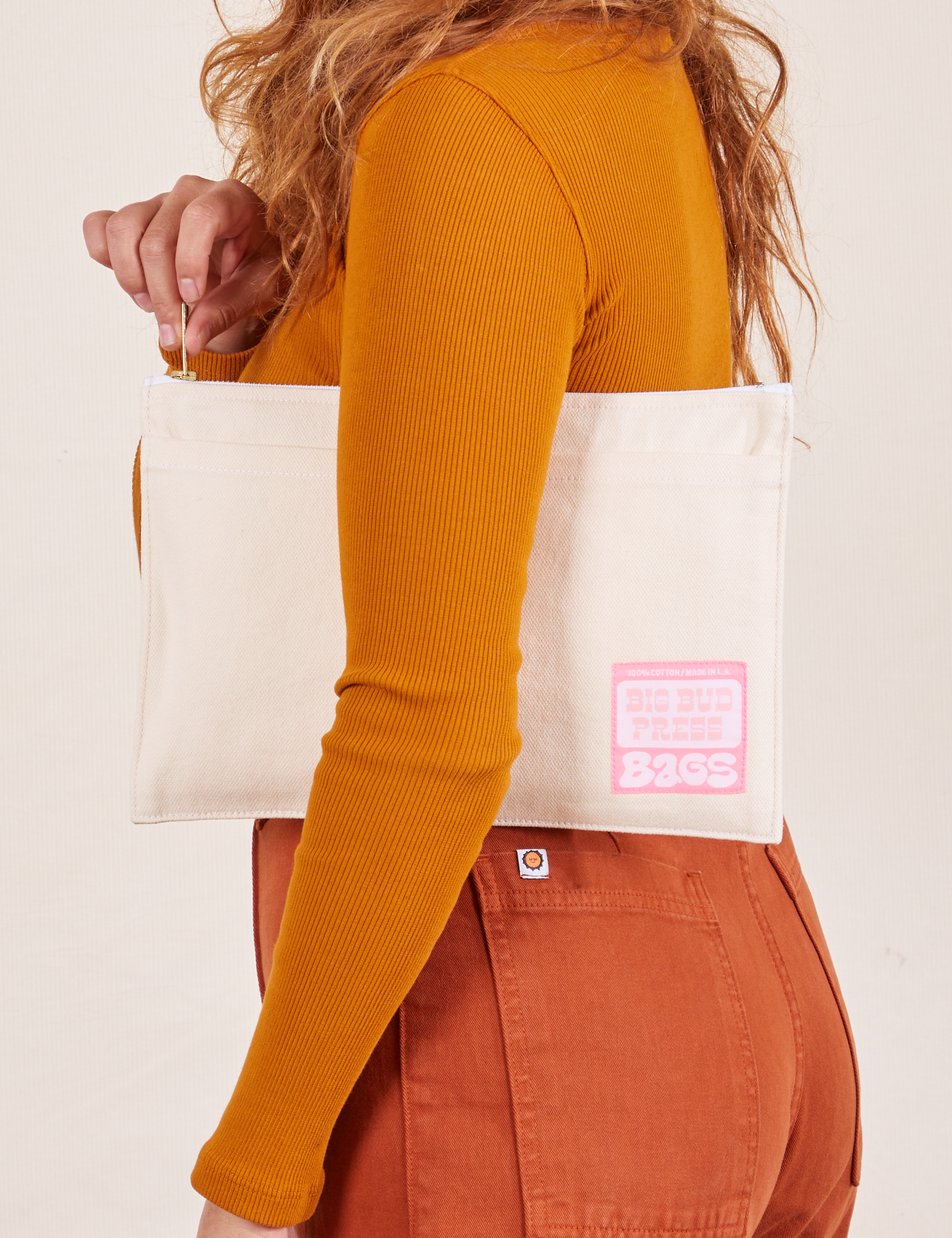 Big Pouch in Vintage Off-White held by model