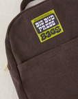 Mini Backpack in Espresso Brown close up with green Big Bud Press label
