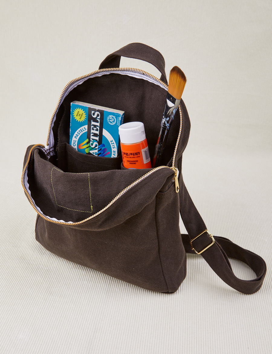 Mini Backpack in Espresso Brown open with things in the interior pockets