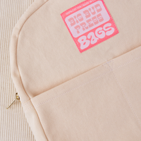Mini Backpack in Vintage Off-White close up with pink Big Bud Press label