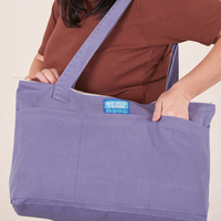 XL Zip Tote in Faded Grape worn over shoulder on Faye