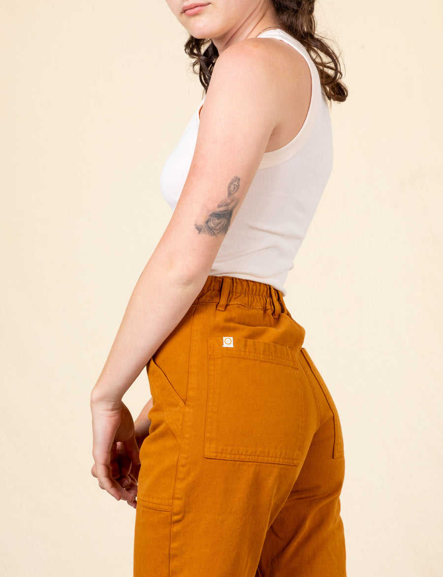 Work Pants in Spicy Mustard back close up on Alex