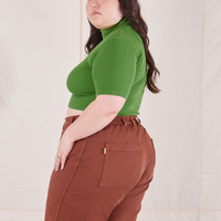 1/2 Sleeve Essential Turtleneck in Bright Olive side view on Ashley wearing fudgesicle brown Bell Bottoms