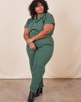 Morgan is 5'5" and wearing 2XL Short Sleeve Jumpsuit in Dark Emerald Green 
