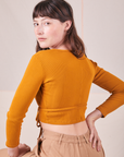 Wrap Top in Spicy Mustard angled back view on Alex