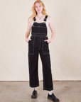 Margaret is 5'11" and wearing XXS Original Overalls in Basic Black
