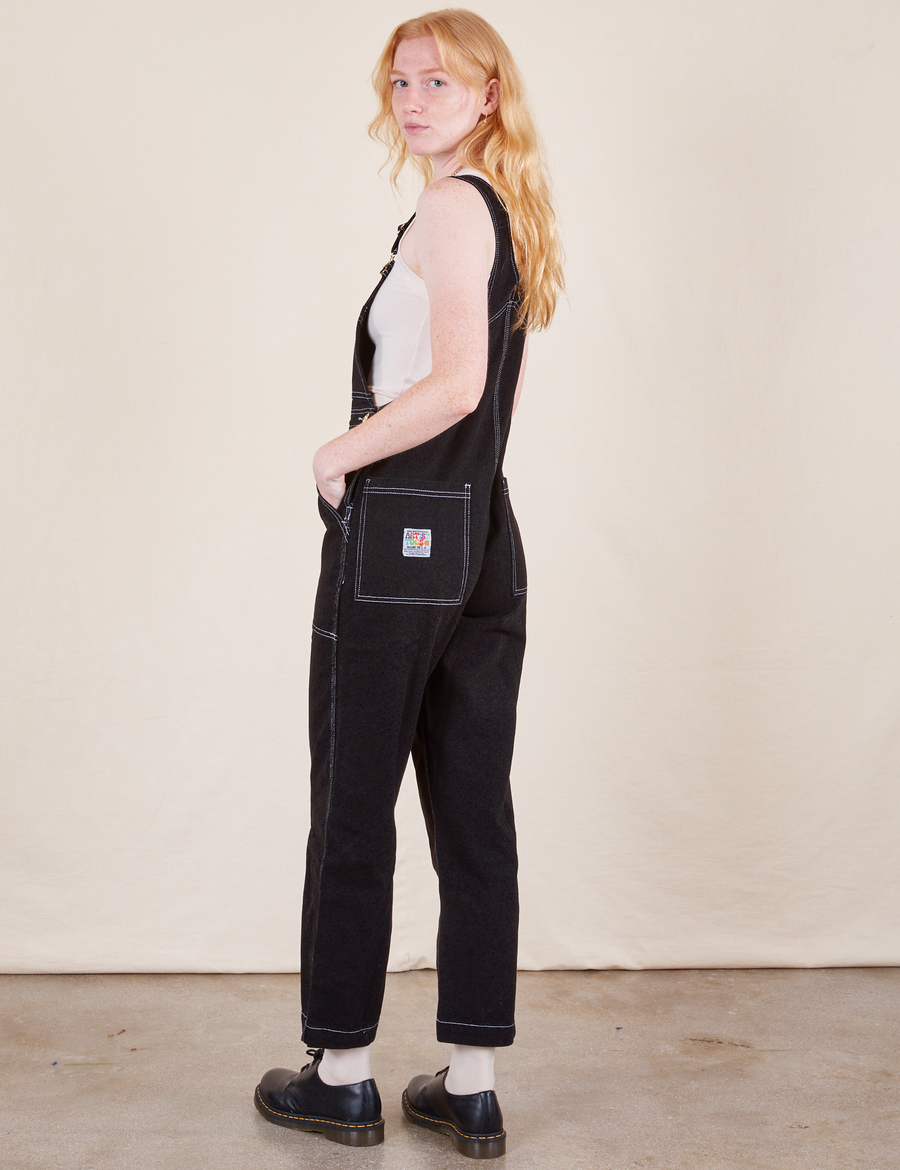 Original Overalls in Basic Black side view on Margaret wearing vintage off-white Tank Top