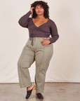 Morgan is 5'5" and wearing 1XL Western Pants in Khaki Grey paired with espresso brown Wrap Top
