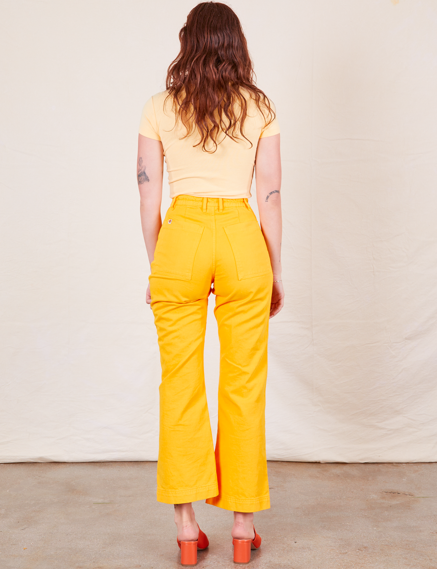 Western Pants in Sunshine Yellow back view on Alex wearing butter yellow Baby Tee