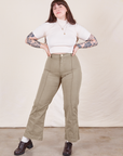 Sydney is 5'9" and wearing M Western Pants in Khaki Grey paired with a vintage off-white 1/2 Sleeve Turtleneck