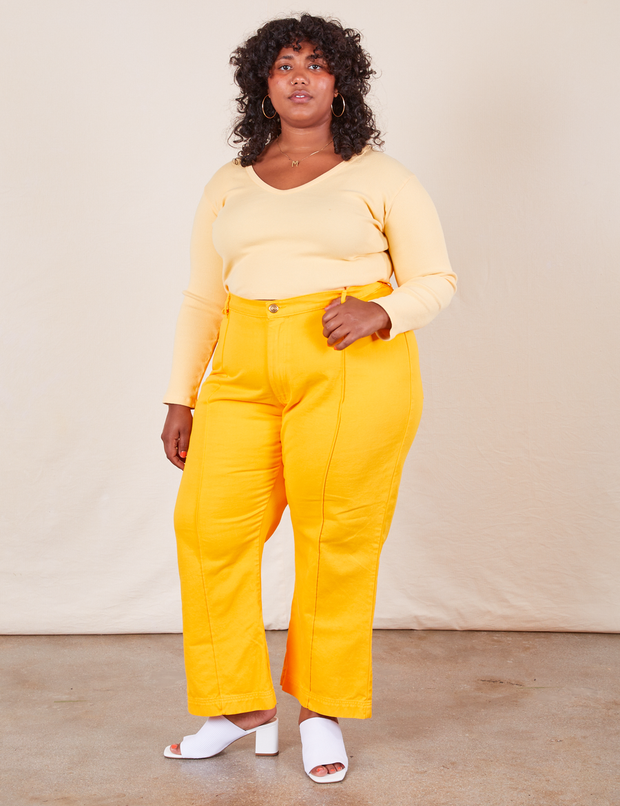 Western Pants in Sunshine Yellow on Morgan wearing butter yellow Long Sleeve V-Neck Tee