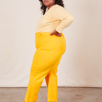 Western Pants in Sunshine Yellow side view on Morgan wearing butter yellow Long Sleeve V-Neck Tee