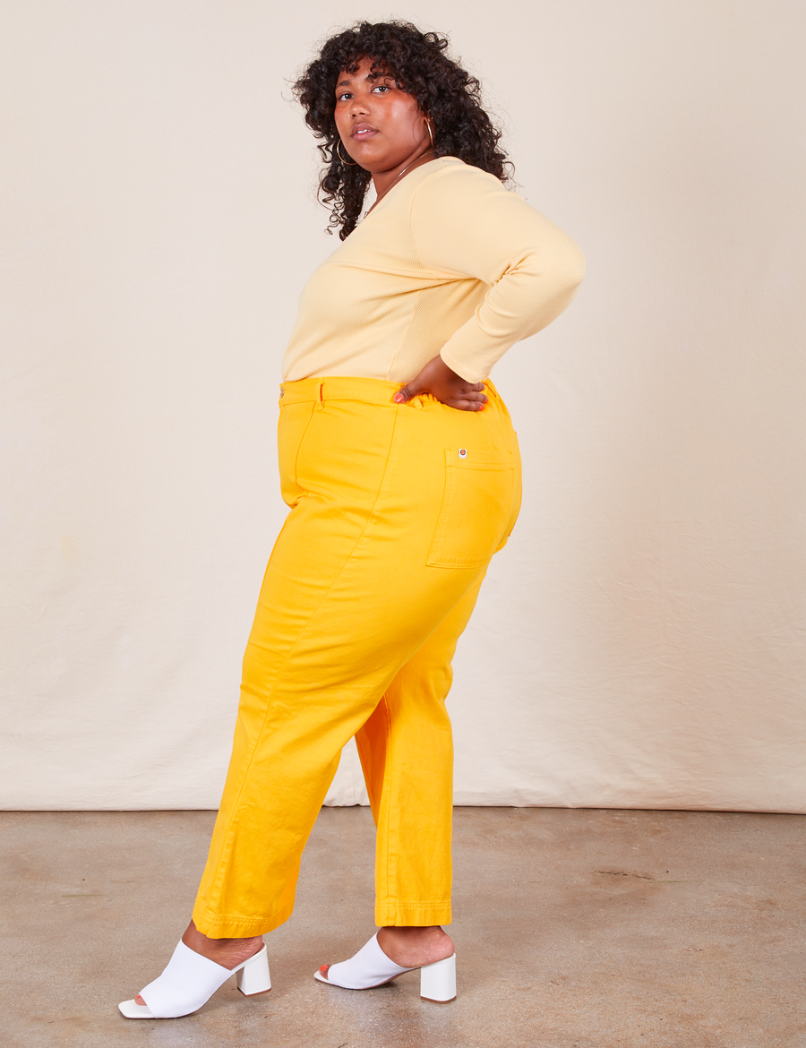 Western Pants in Sunshine Yellow side view on Morgan wearing butter yellow Long Sleeve V-Neck Tee