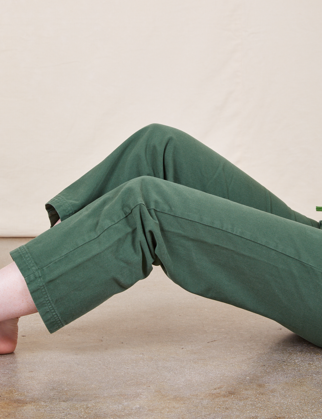 Work Pants in Dark Emerald Green leg close up on Margaret 
