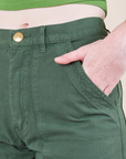 Work Pants in Dark Emerald Green front pocket close up on Margaret