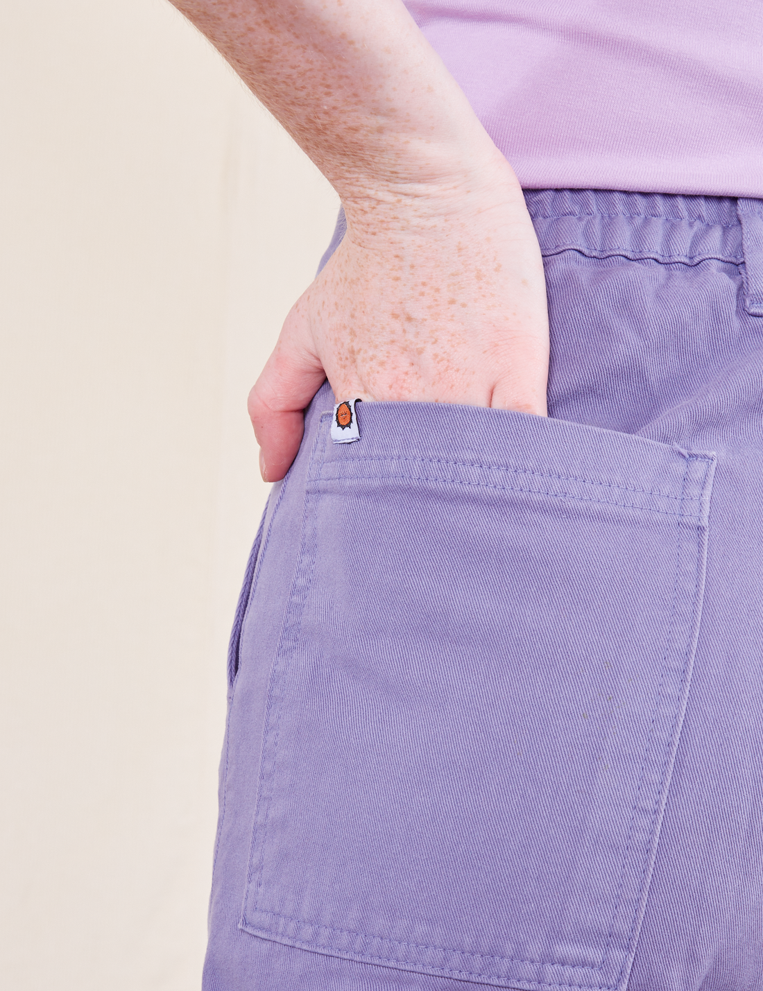Work Pants in Faded Grape back pocket close up