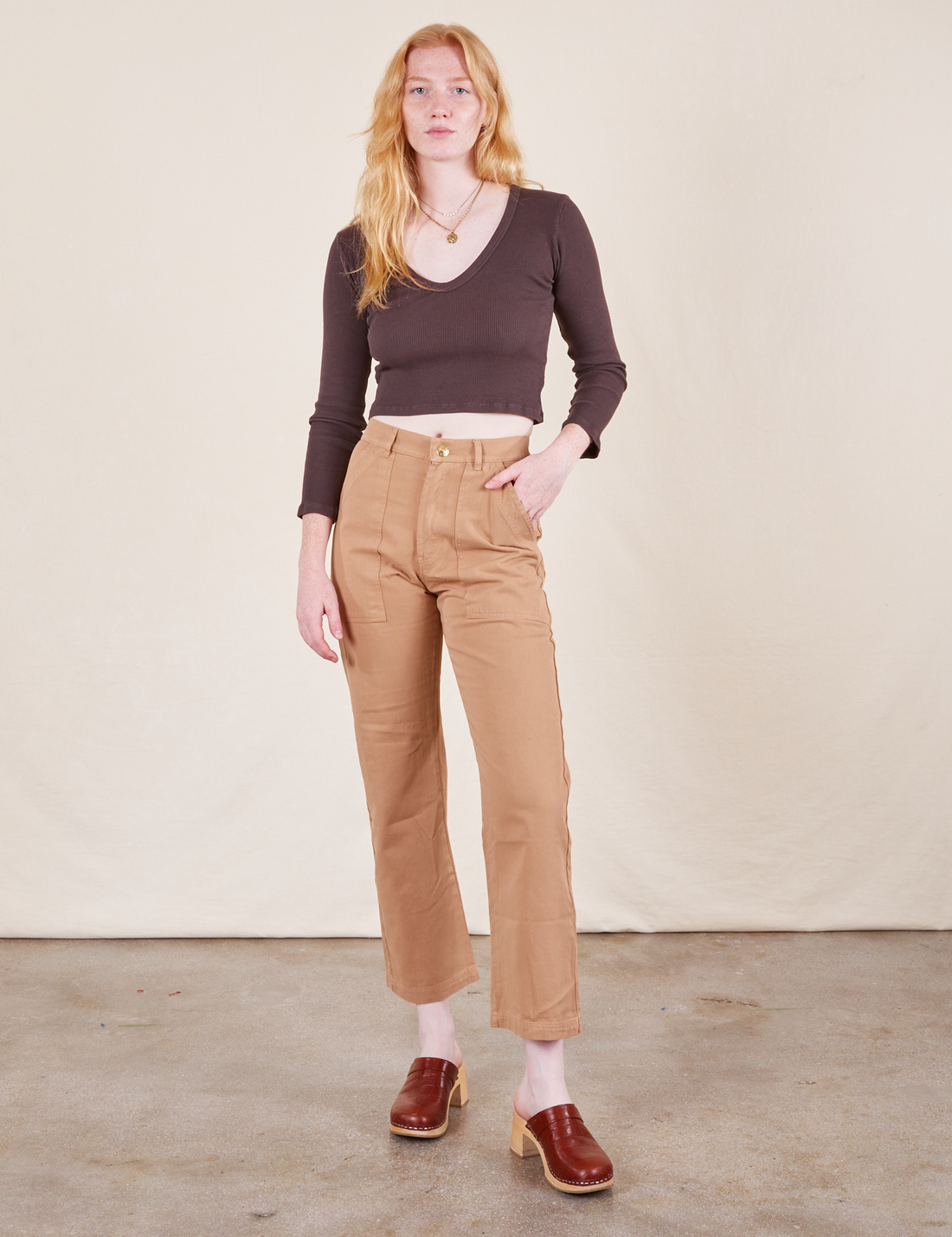 Work Pants in Tan on Margaret wearing espresso brown Long Sleeve V-Neck Tee