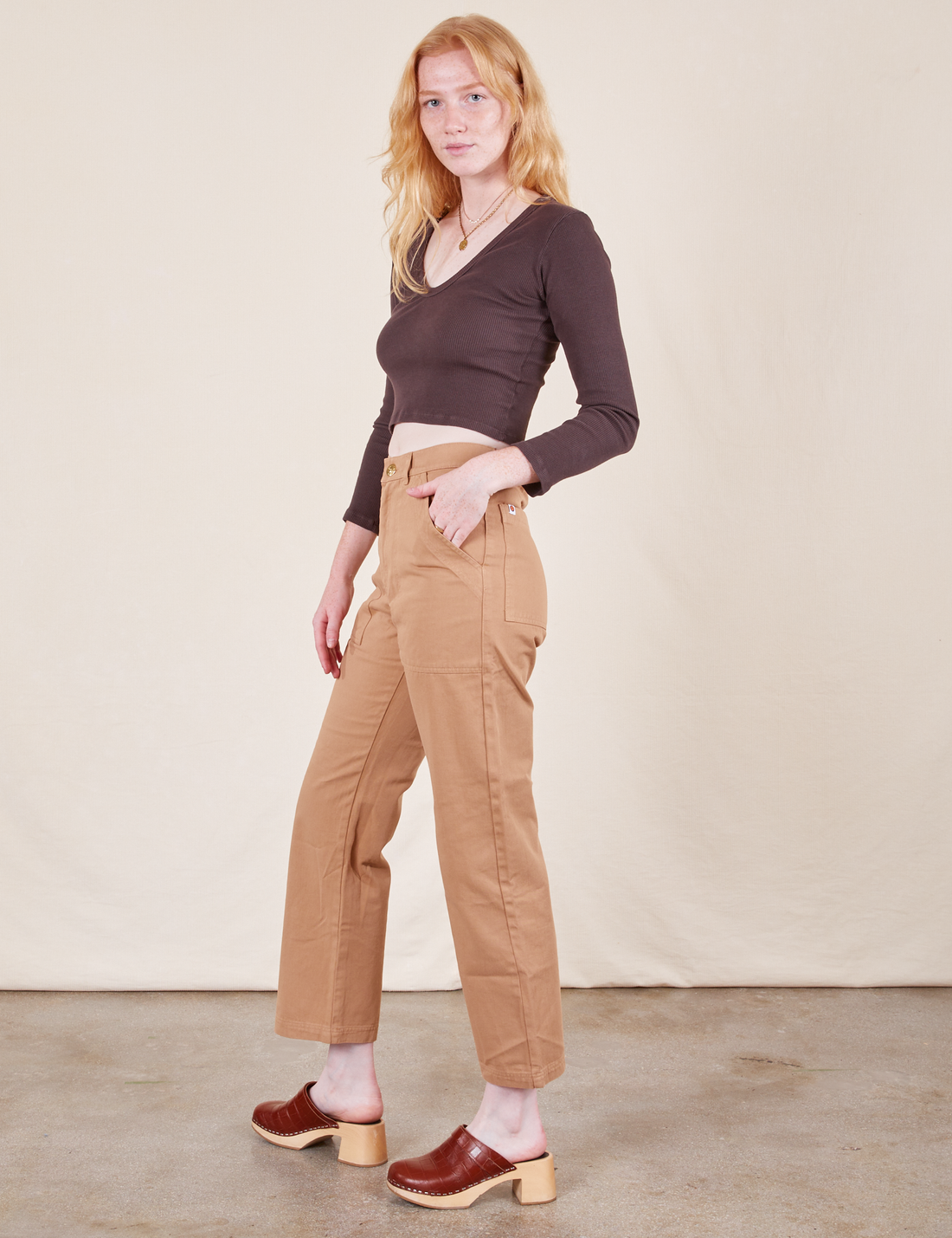 Work Pants in Tan side view on Margaret wearing espresso brown Long Sleeve V-Neck Tee