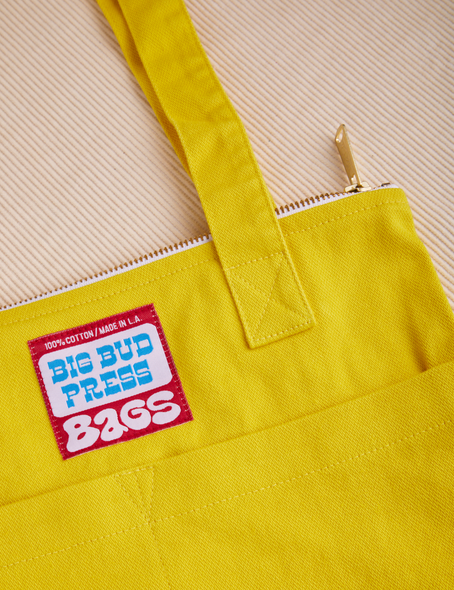 Over-Shoulder Zip Mini Tote in golden yellow close up detail top of bag
