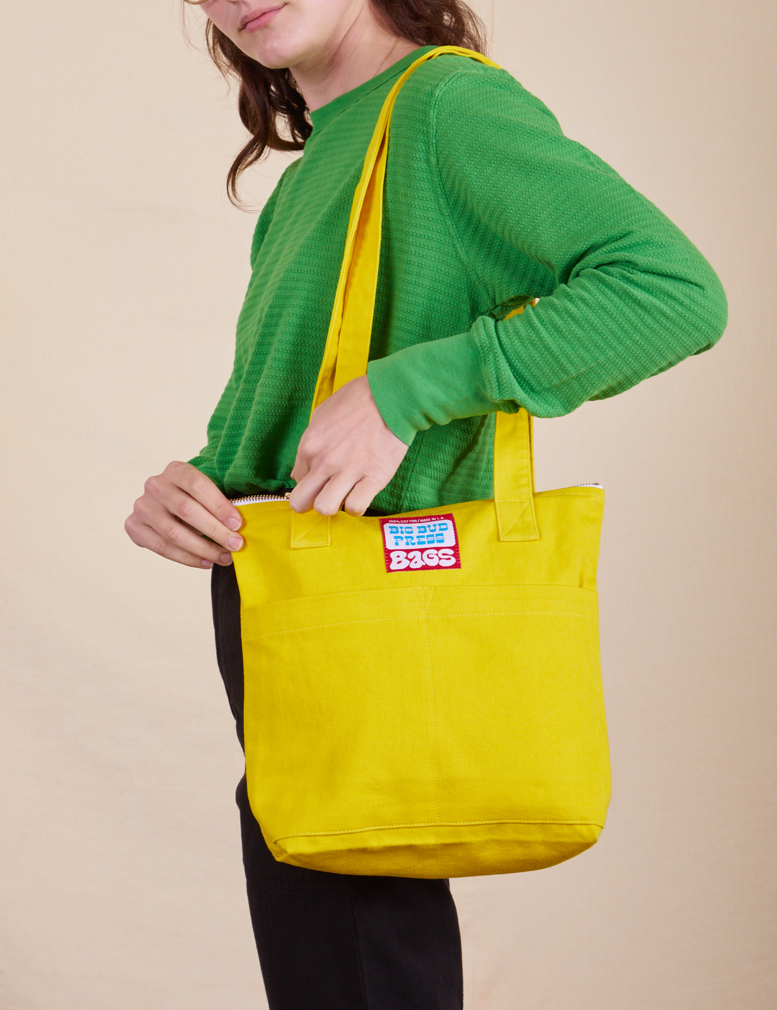 Over-Shoulder Zip Mini Tote in golden yellow worn by model