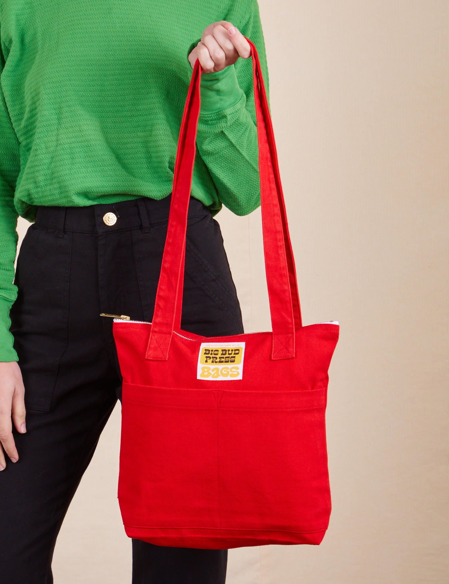 Over-Shoulder Zip Mini Tote in mustang red held by model