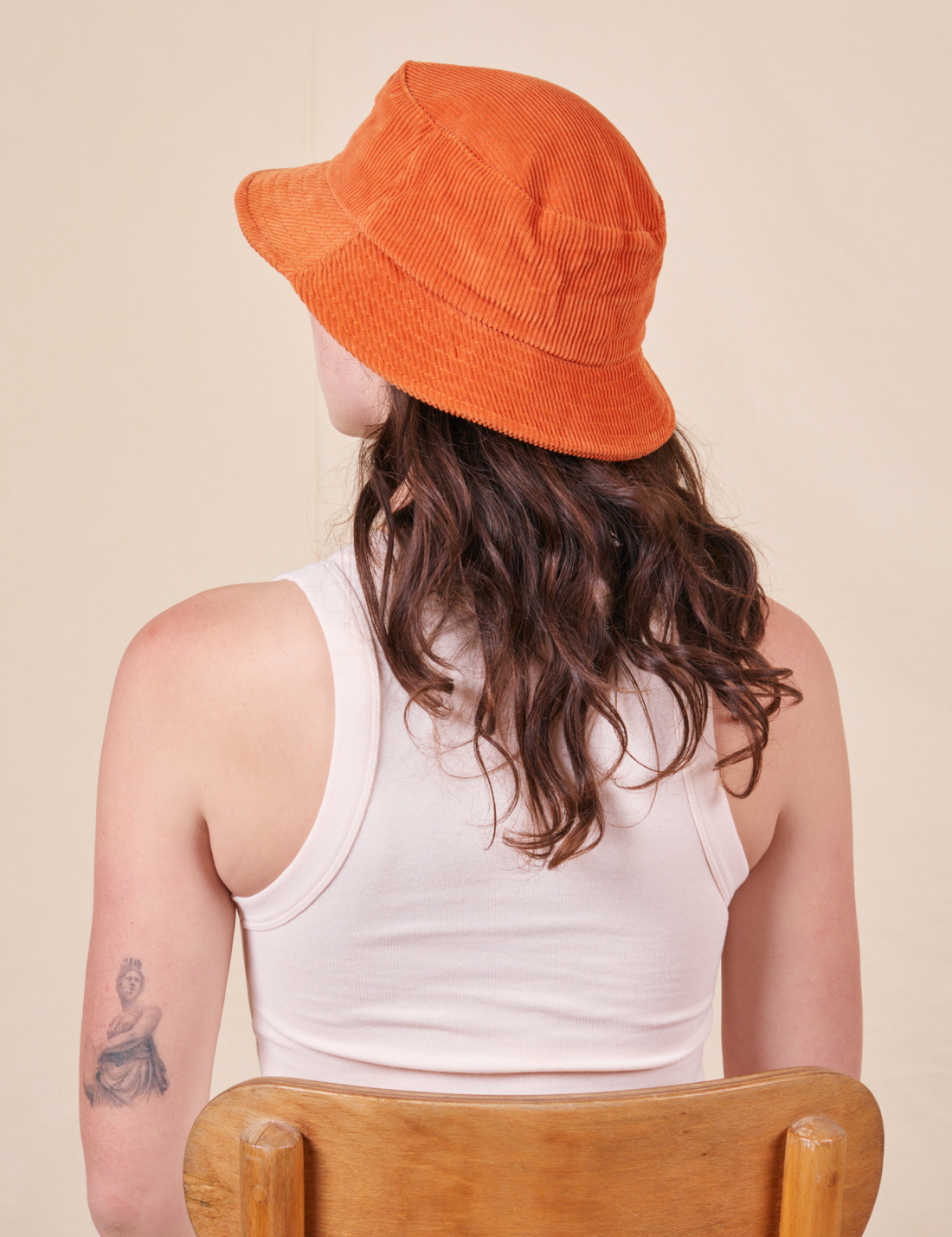 Big Bud Bucket Hat in burnt orange back view worn by Alex