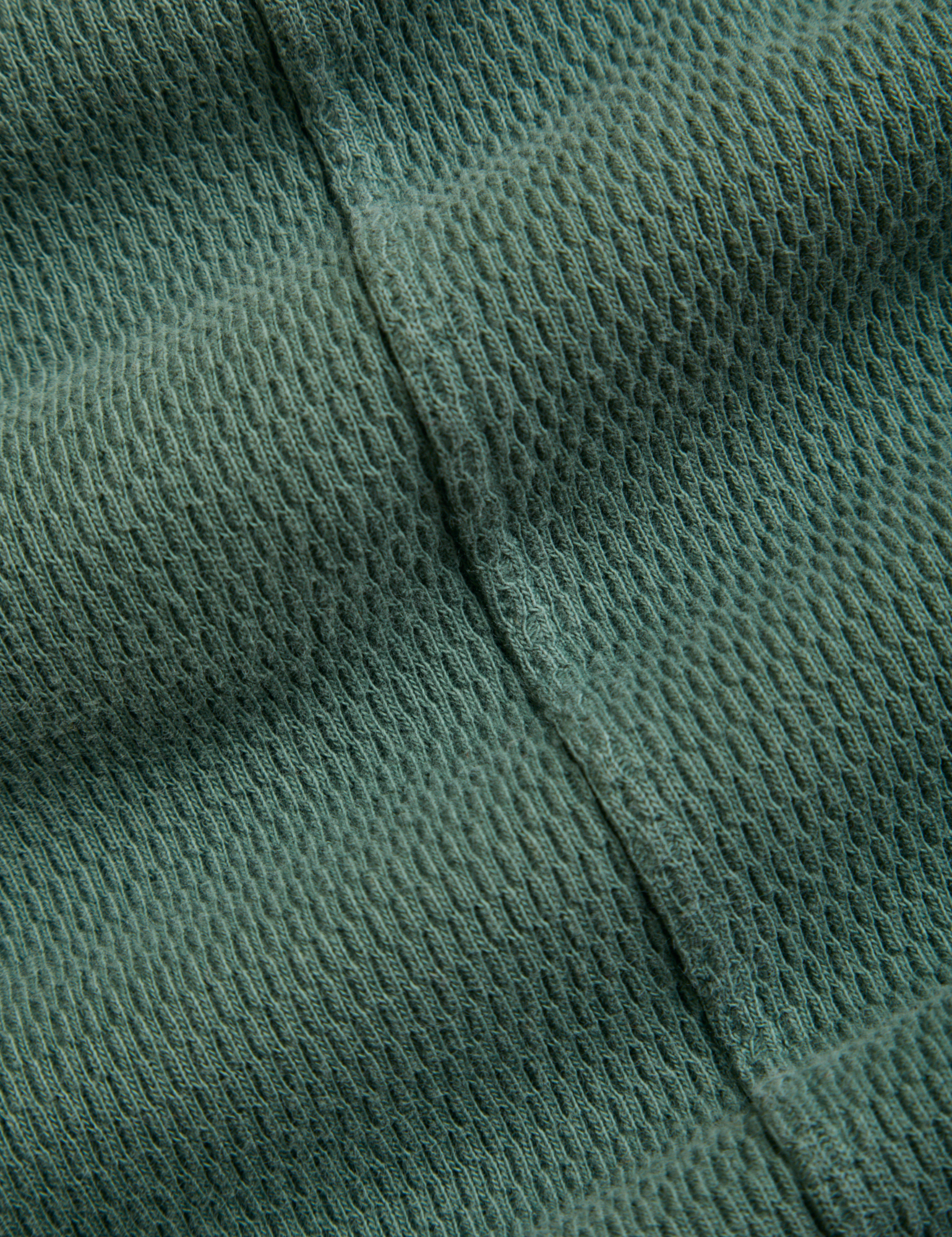 Long Sleeve Fisherman Polo in Dark Emerald Green fabric detail close up