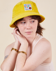 Big Bud Bucket Hat in golden yellow worn by Hana