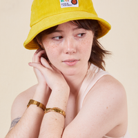 Big Bud Bucket Hat in golden yellow worn by Hana